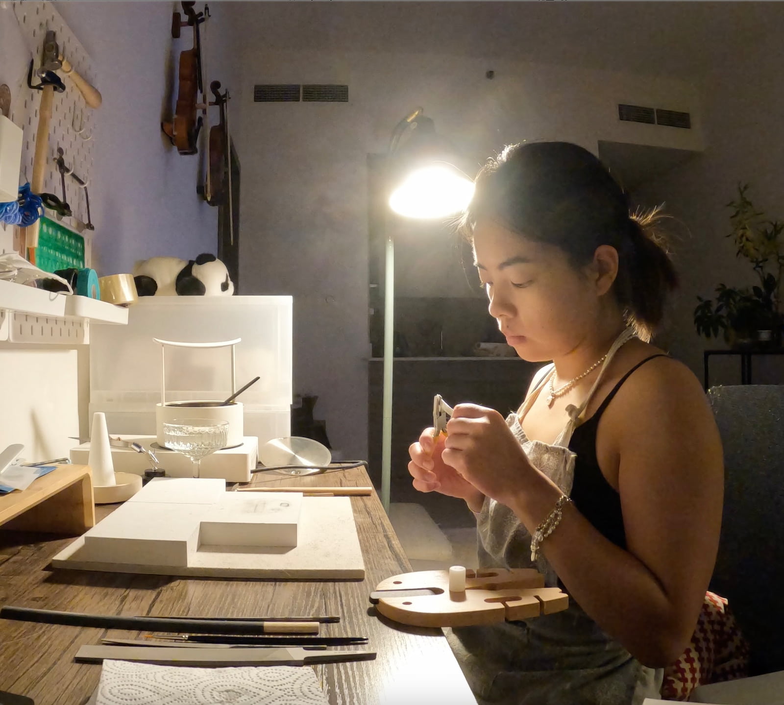 At the bench — making something by hand
